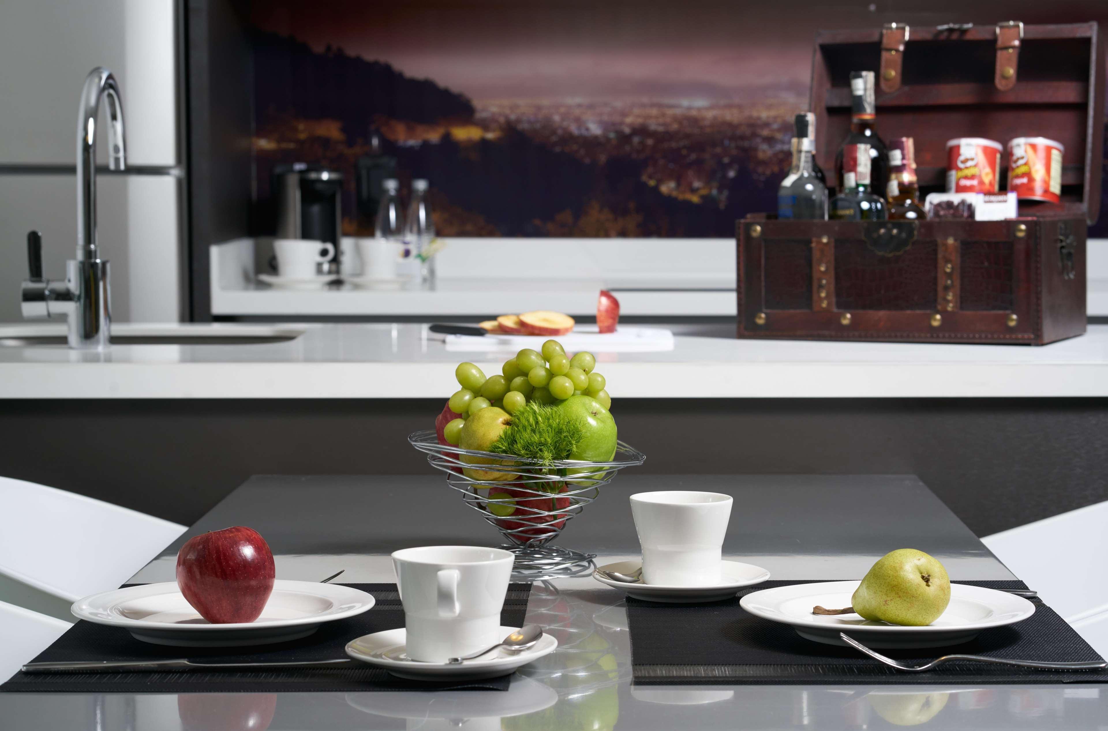 Hotel 100 Luxury Suites By Preferred Bogotá Eksteriør billede A kitchen with a built-in coffee machine