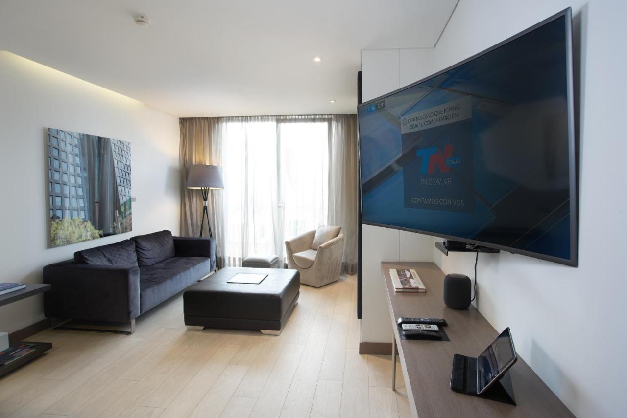 Hotel 100 Luxury Suites By Preferred Bogotá Eksteriør billede A television set in a hotel room